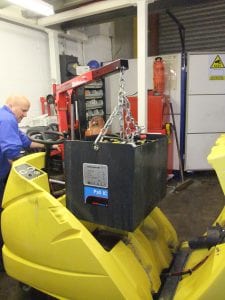 Scrubber Drier batteries being lifted out for replacement.